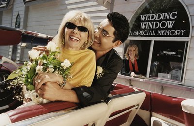 A couple at a wedding drive through.