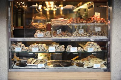 Italian shop window with calzone, stromboli, sandwiches and desserts