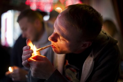 Smoking marijuana dehydrates your body which in turn will dry out your throat.