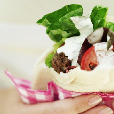 Middle-Eastern food features plenty of vegetables and pita.