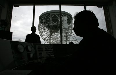 Astronomers work the control panel of the Jodrell Bank Lovell radio telescope in Macclesfield, England
