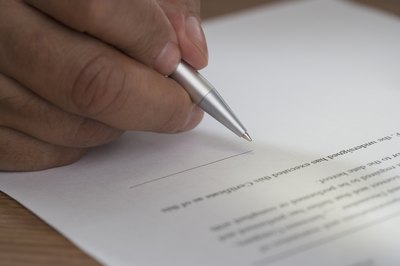 Hand signing paperwork