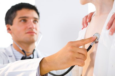 doctor listening to patient's heart