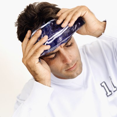 Man with icepack on forehead