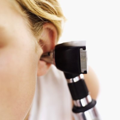 Doctor looking in patients ear