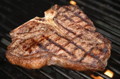 A steak cooks on a girl.