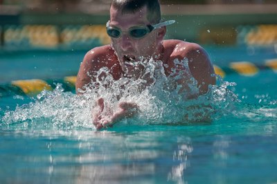 Competitive swimmer using the breast stroke