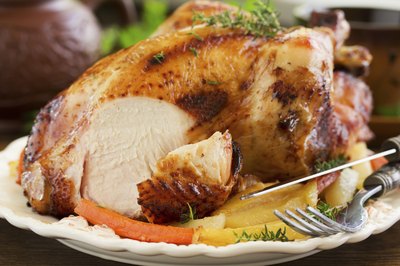 Roast chicken atop a bed of root vegetables for an easy one-pot meal.