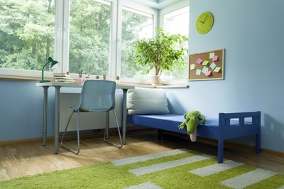 A calm child's room with blue and green accents.