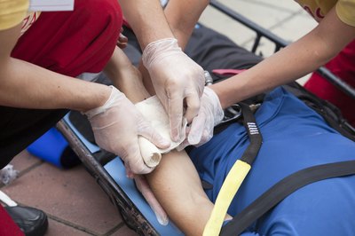 Man receiving first aid for injury