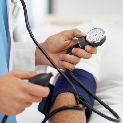 Doctor checking blood pressure