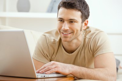 Small business owner working on laptop