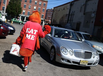Man dressed in lobster costume walking in Portland, Maine