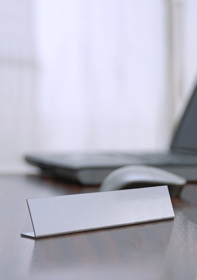 Nameplate on desk.