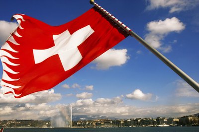 Geneva, Switzerland behind Swiss Flag