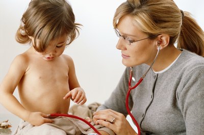 Little girl holding stethoscope