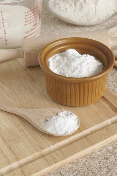 A small bowl of baking soda laying on a table