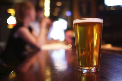 An alcoholic is used to having a drink in her hand at all times.