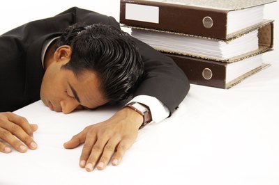 Young business man taking a nap.
