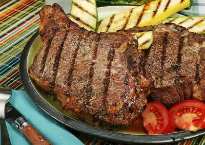 A grilled black angus rib-eye steak