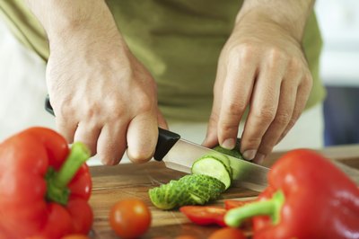 man slicing vegetables