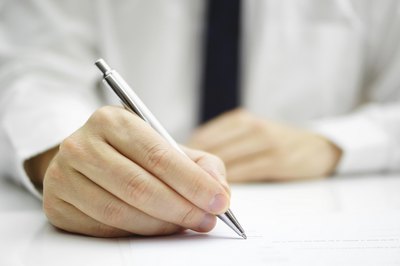 Man completing business forms
