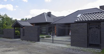 A dark house with a gray roof can look sleek and modern/