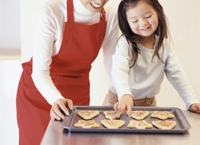 Girl looking at Christmas cookies