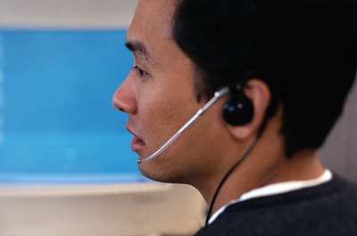 A close-up of an employee working at his desk.