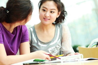 women in conversation at table