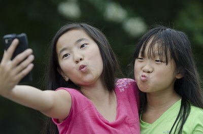 Girls taking photos on a phone