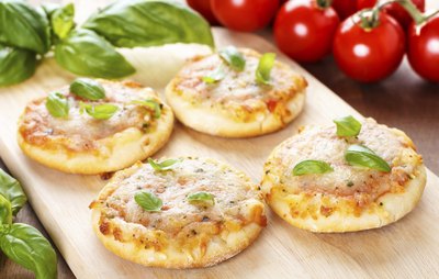 Homemade mini pizzas on a wooden board
