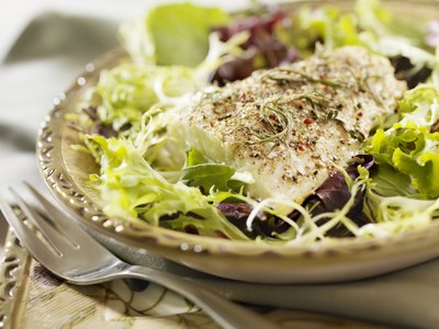 grilled fish on healthy salad