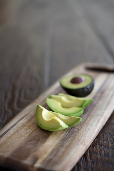 Sliced avocados on a cutting board