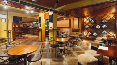 Mismatched wooden furniture in a Southern restaurant.