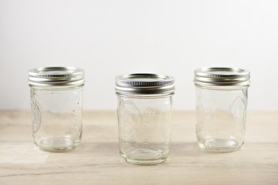 Three empty canning jars.