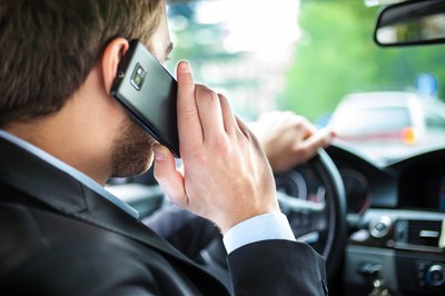 Man driving on phone