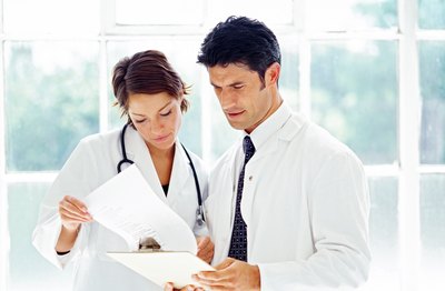 Doctors looking at charts