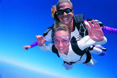 Woman tandem skydiving