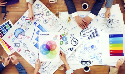 Group of employees in marketing meeting.
