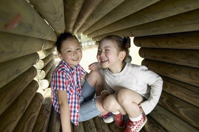 Girls laughing at indoor playground