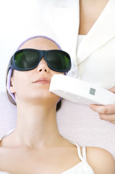 A woman receiving a laser treatment.