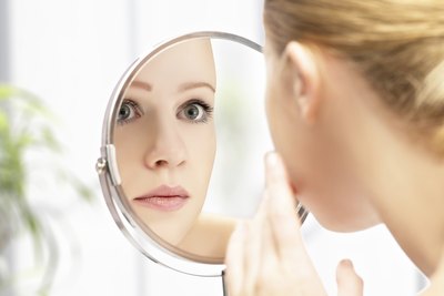 Woman looking at skin