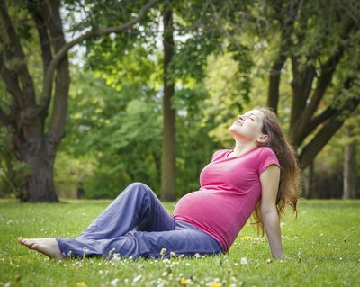 Pregnant woman in field