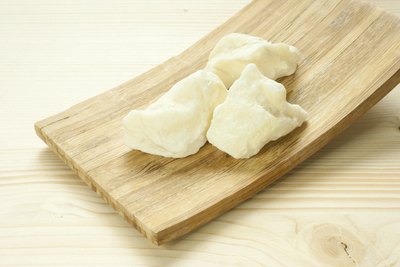Shea butter on wooden slate.