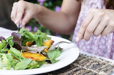 Woman eating salad