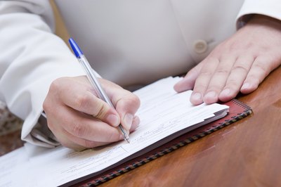 man filling out paperwork