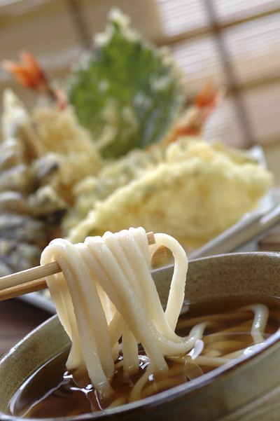 Chopsticks holding udon