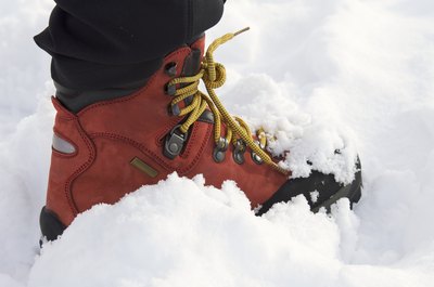 A snow boot with laces.