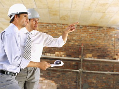 Two architects discussing the ceiling.